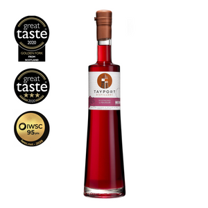 Bottle of Tayport Distillery Raspberry Liqueur with award seals indicating a 3-Star Great Taste and IWSC 95 points.