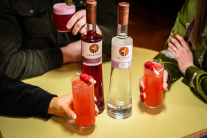 Friends enjoying Tayport Distillery Raspberry Tom Collins Cocktail photo