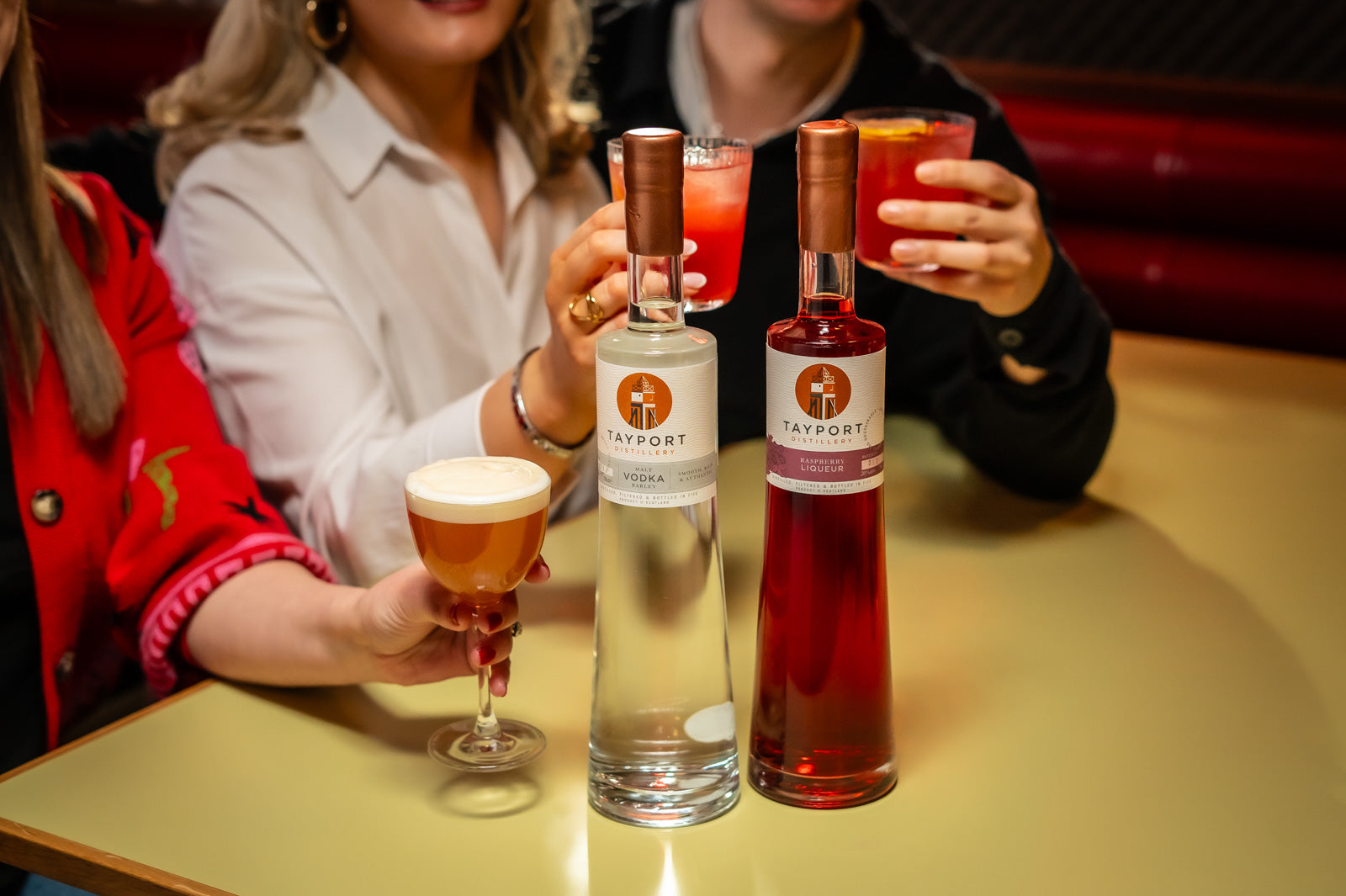 Group drinking a french martini using Tayport Distillery Raspberry Liqueur and Malt Barley Vodka